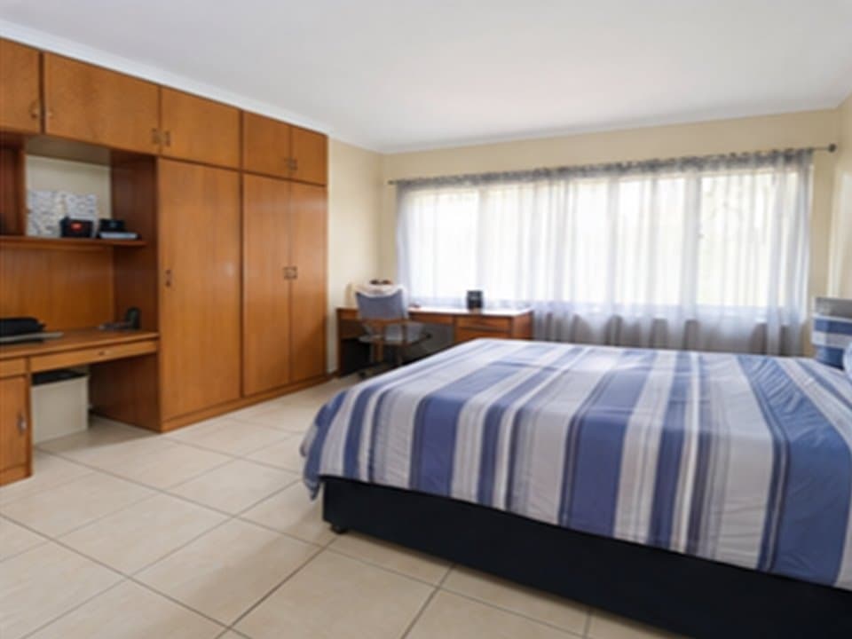 Student room with bed and study space